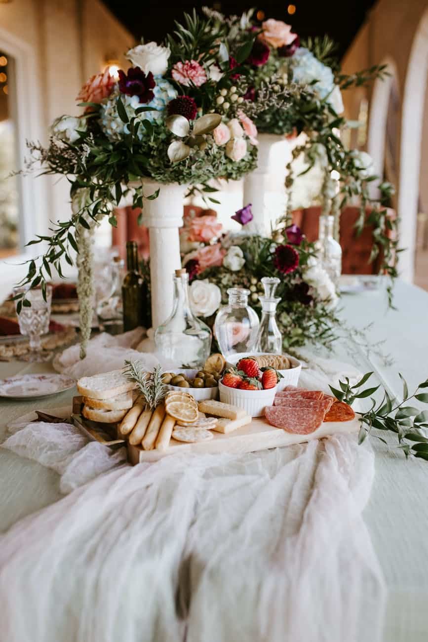 elegant wedding table with bouquets and food