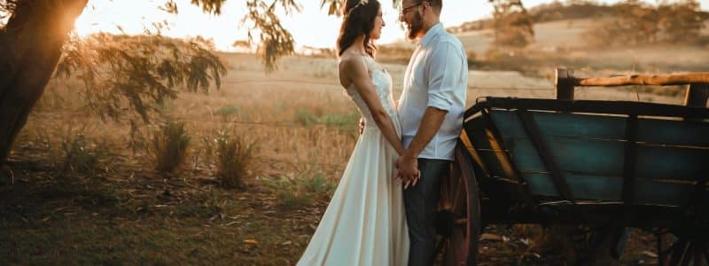 man and woman standing beside carriage