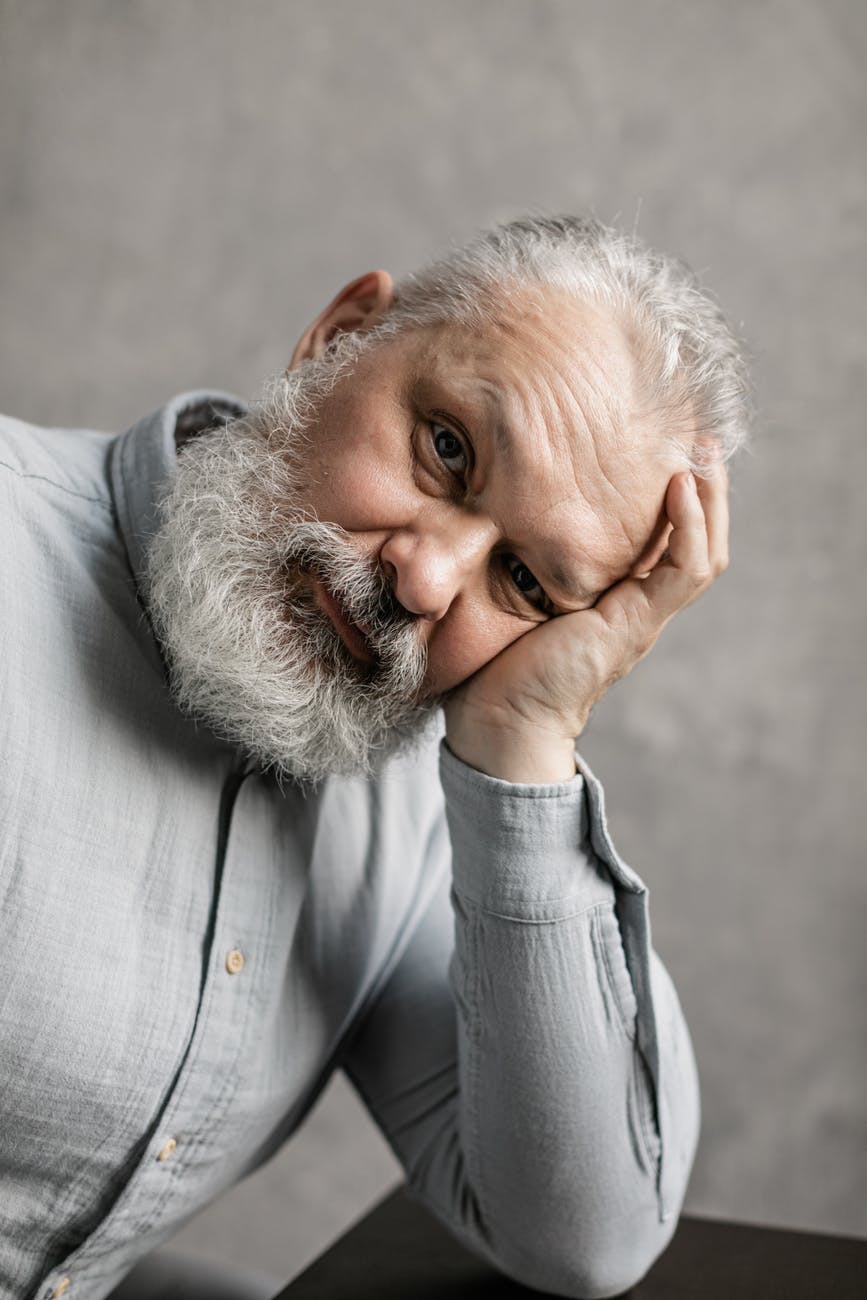 elderly man in gray long sleeves